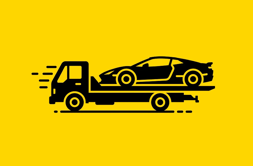 Carro esportivo de alto padrão sendo posicionado na plataforma para transporte